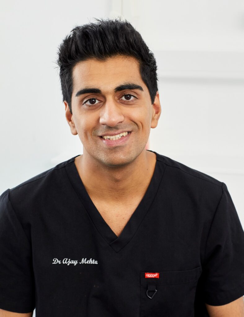 A professional headshot of associate dentist Dr Ajay Mehta